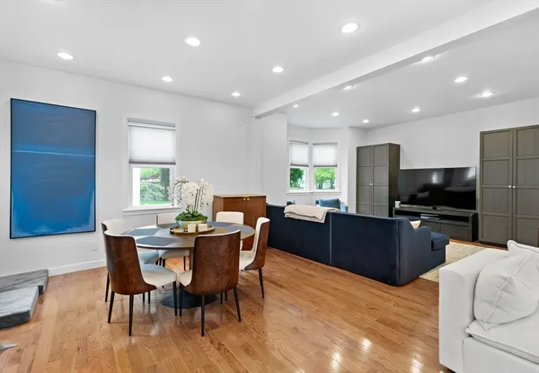 a view of a dining room with furniture window and wooden floor