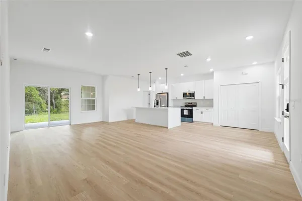 a view of a kitchen with a sink and a window