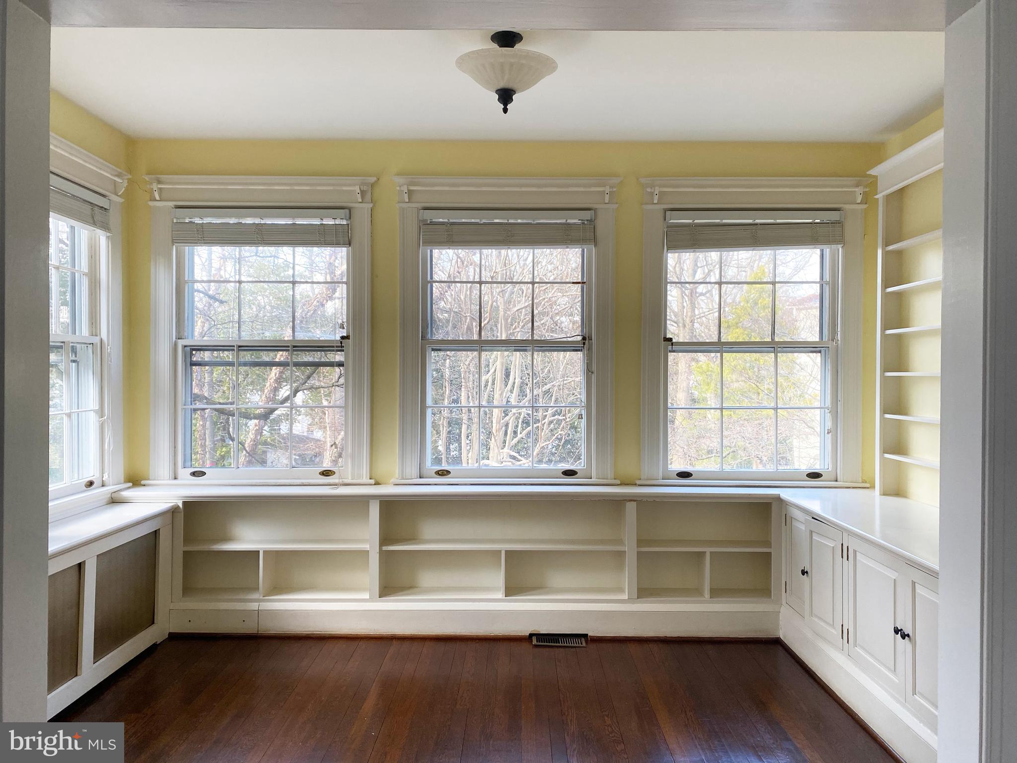 4103 Bradley Lane Chevy Chase, MD 20815 - Photo 4 of 6 Cozy family room surrounded by windows, built-ins