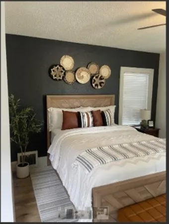 a bedroom with a bed and dresser