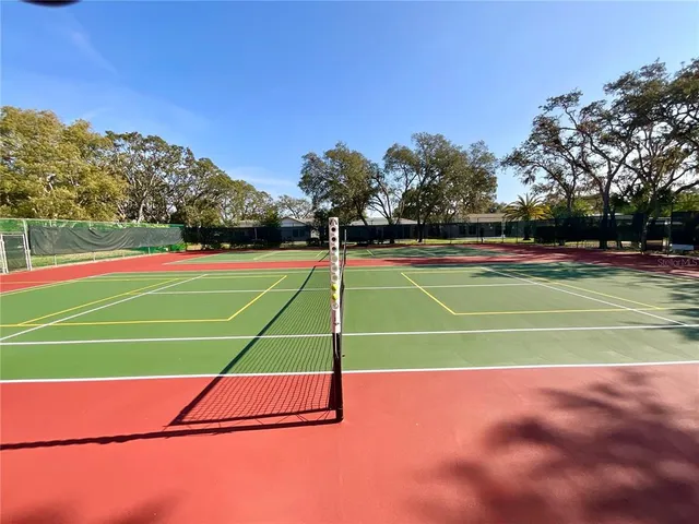 a tennis court that has tennis net