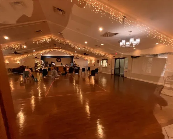 a group of people sitting at kitchen floor