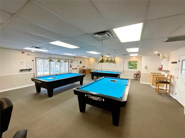 a living room with lots of furniture and a chandelier