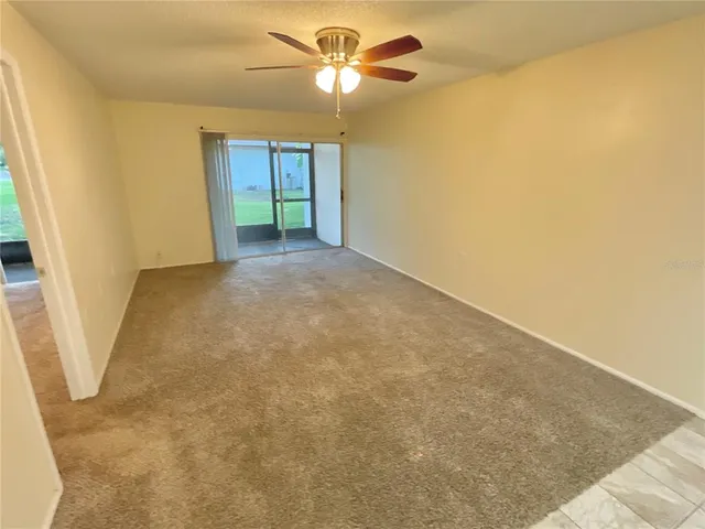 a view of a big room with carpet