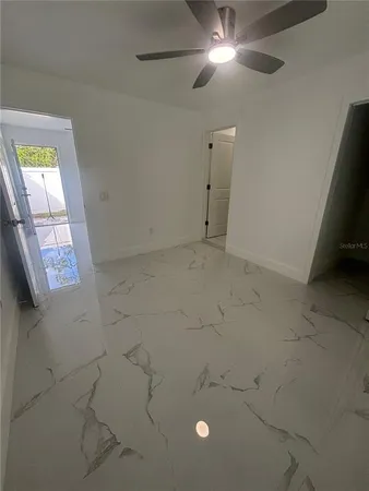 a view of an empty room and window