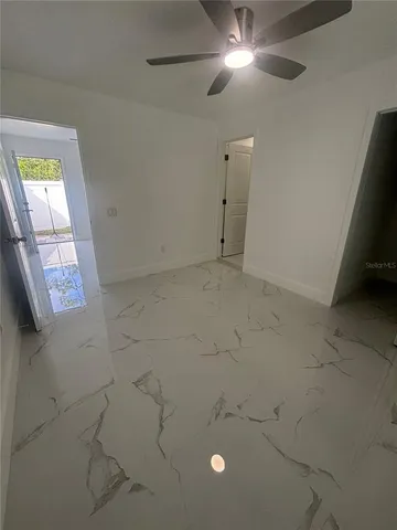 a view of an empty room and window