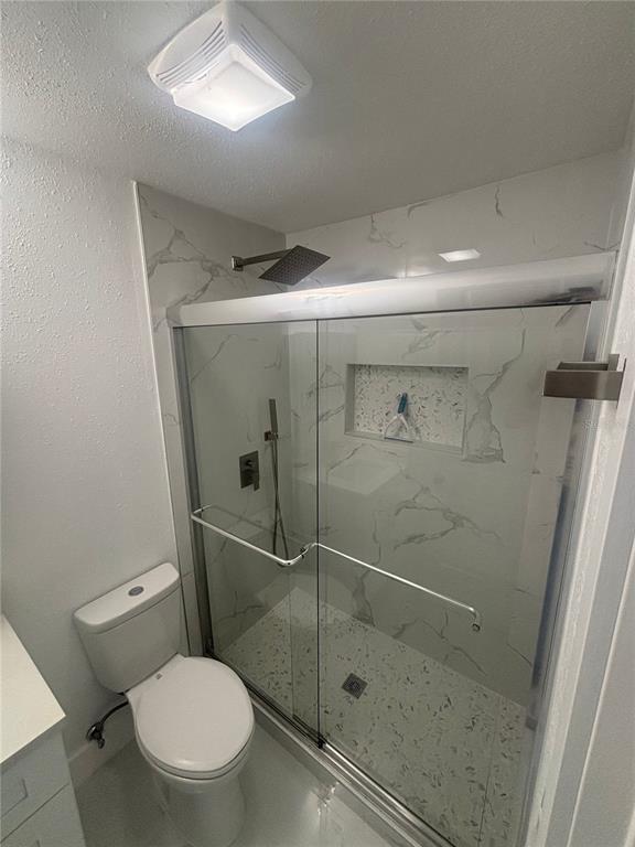 1524 Windermere Road, Unit B Winter Garden, FL 34787 - Photo 8 of 8 a bathroom with a toilet and a shower