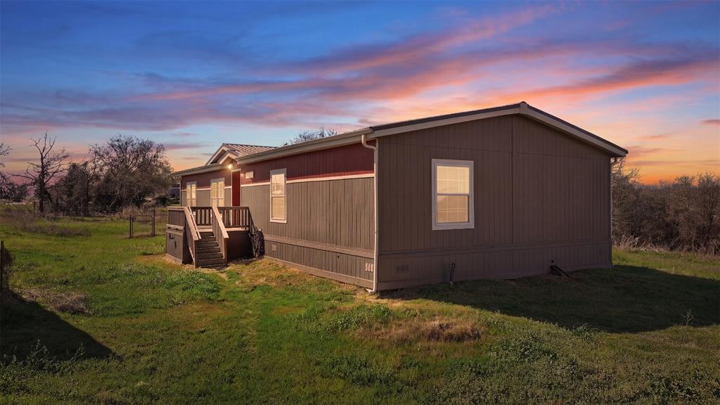 151 Private Road 3814 Springtown, TX 76082 - Photo 26 of 29 a view of backyard with trampoline