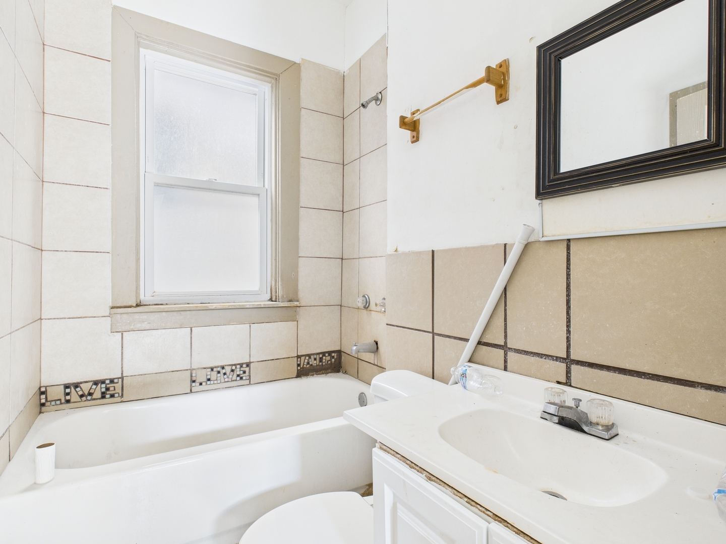 8709 South Escanaba Avenue Chicago, IL 60617 - Photo 13 of 31 a bathroom with a sink and a bathtub