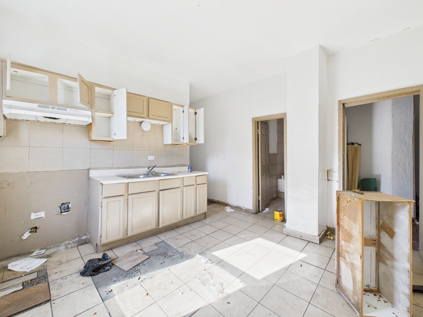 8709 South Escanaba Avenue Chicago, IL 60617 - Photo 15 of 31 a bathroom with a sink a toilet and a mirror