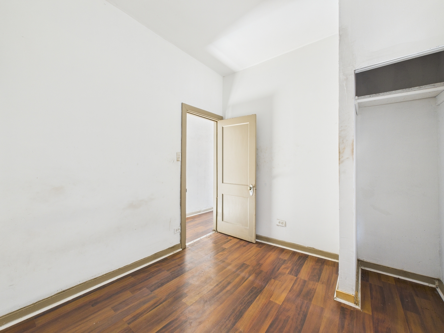8709 South Escanaba Avenue Chicago, IL 60617 - Photo 17 of 31 a view of an empty room with wooden floor