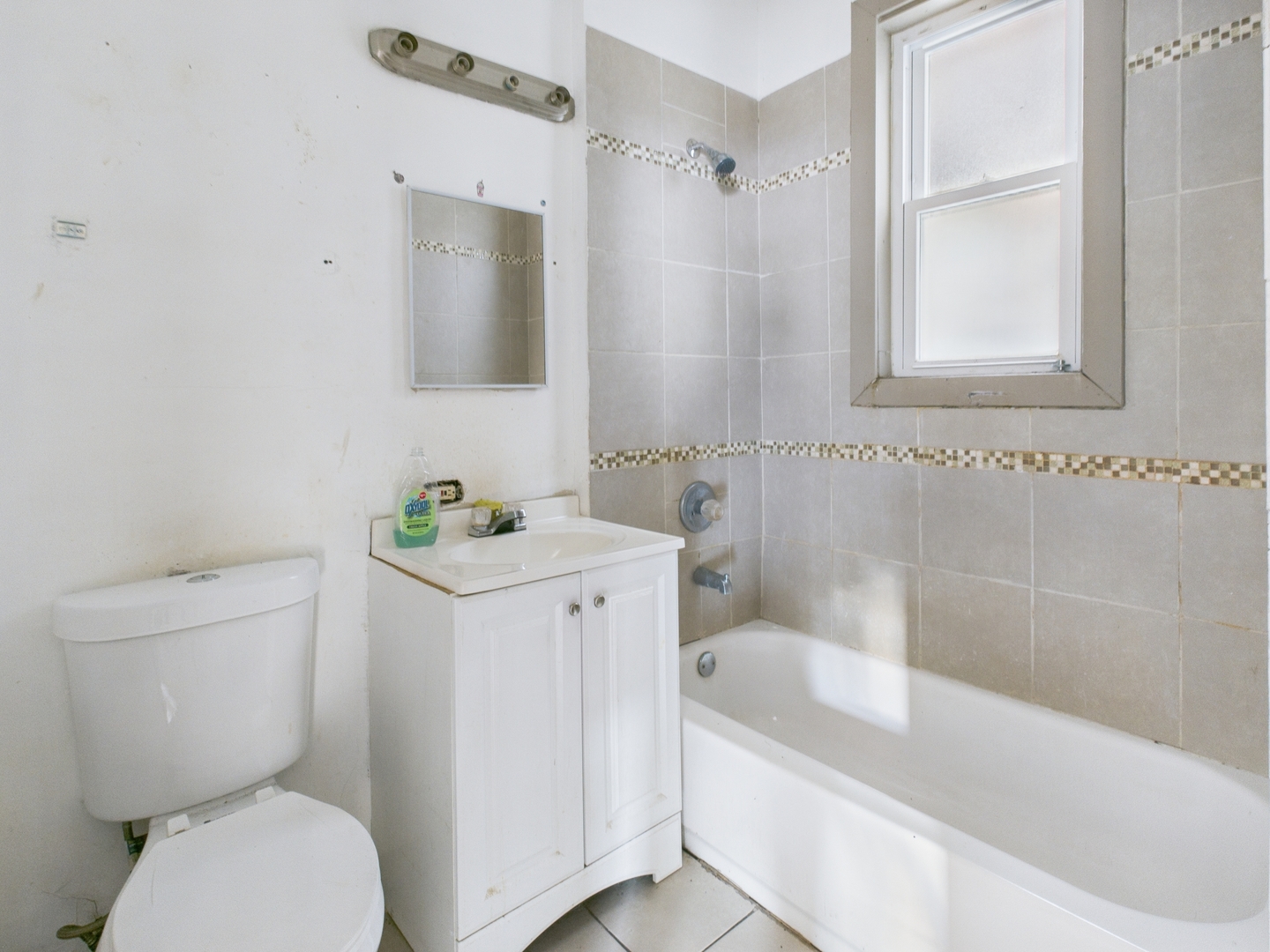 8709 South Escanaba Avenue Chicago, IL 60617 - Photo 25 of 31 a bathroom with a sink toilet and bathtub