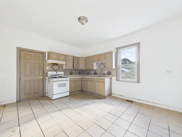a kitchen with stainless steel appliances a white cabinet and a sink