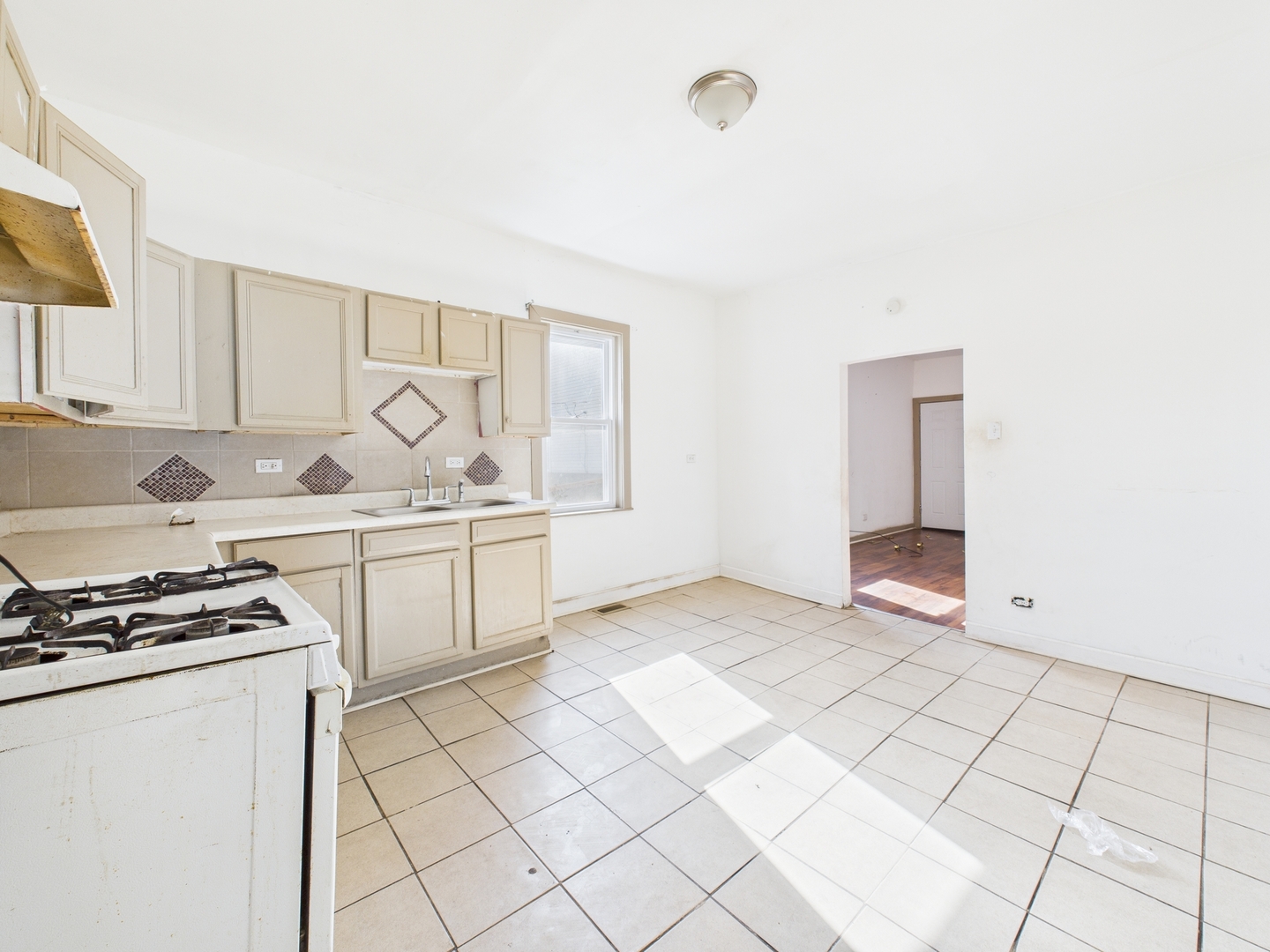 8709 South Escanaba Avenue Chicago, IL 60617 - Photo 28 of 31 a kitchen that has a sink and a stove