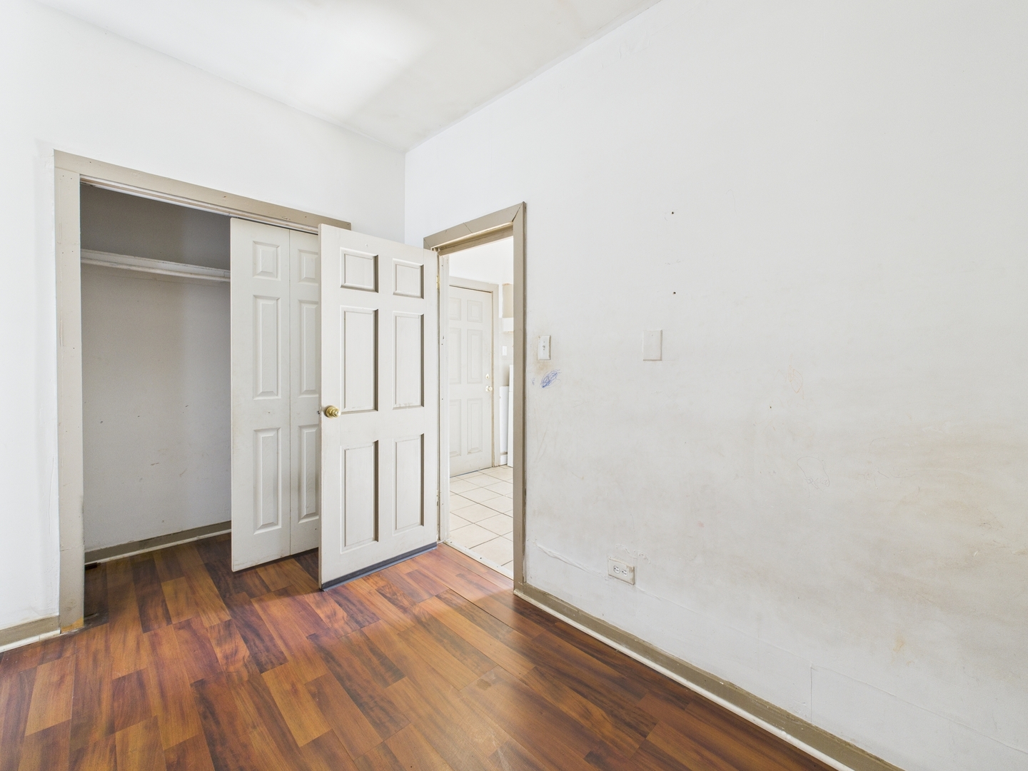8709 South Escanaba Avenue Chicago, IL 60617 - Photo 29 of 31 a view of empty room with wooden floor