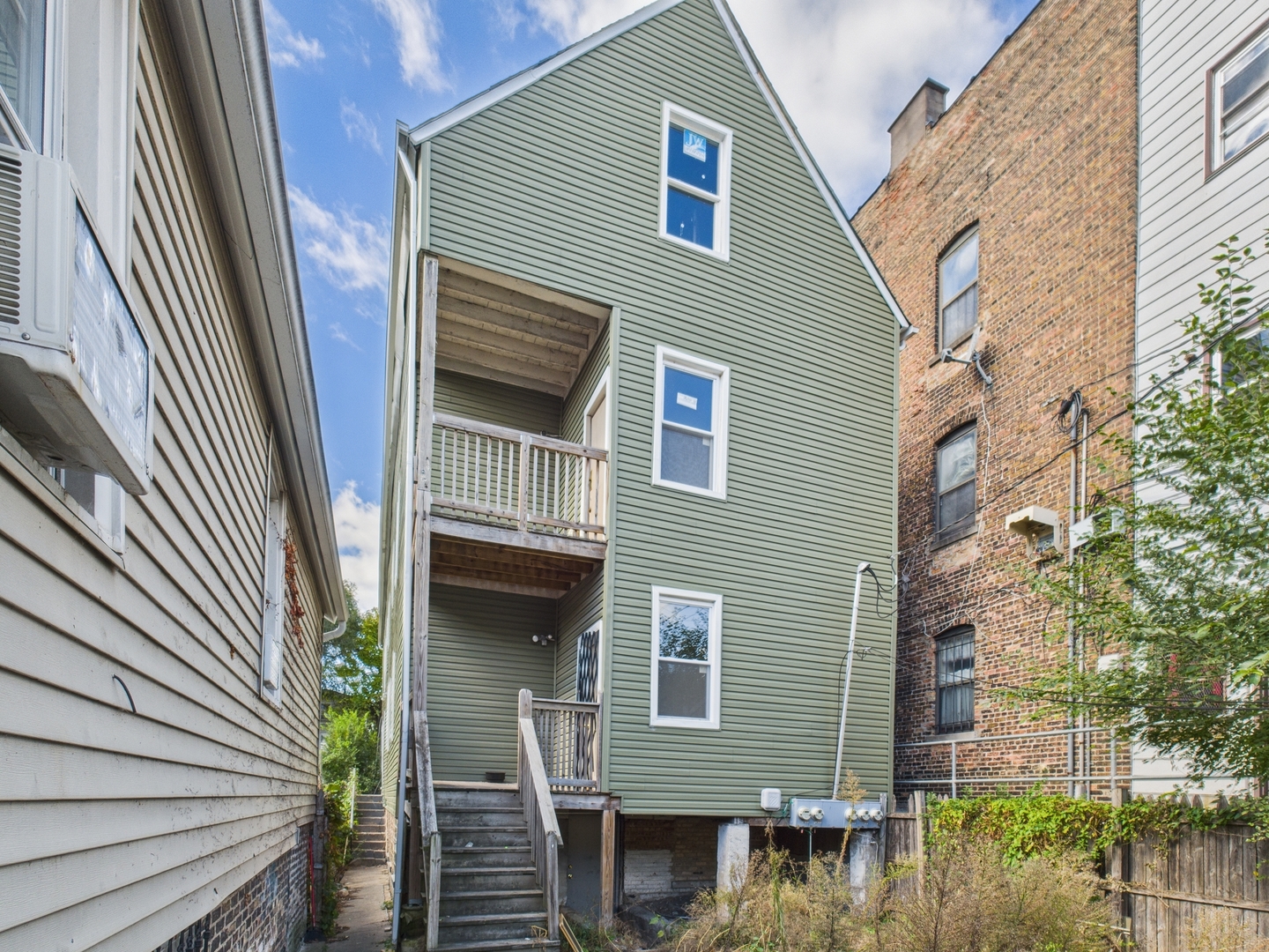 8709 South Escanaba Avenue Chicago, IL 60617 - Photo 31 of 31 a front view of a house with balcony