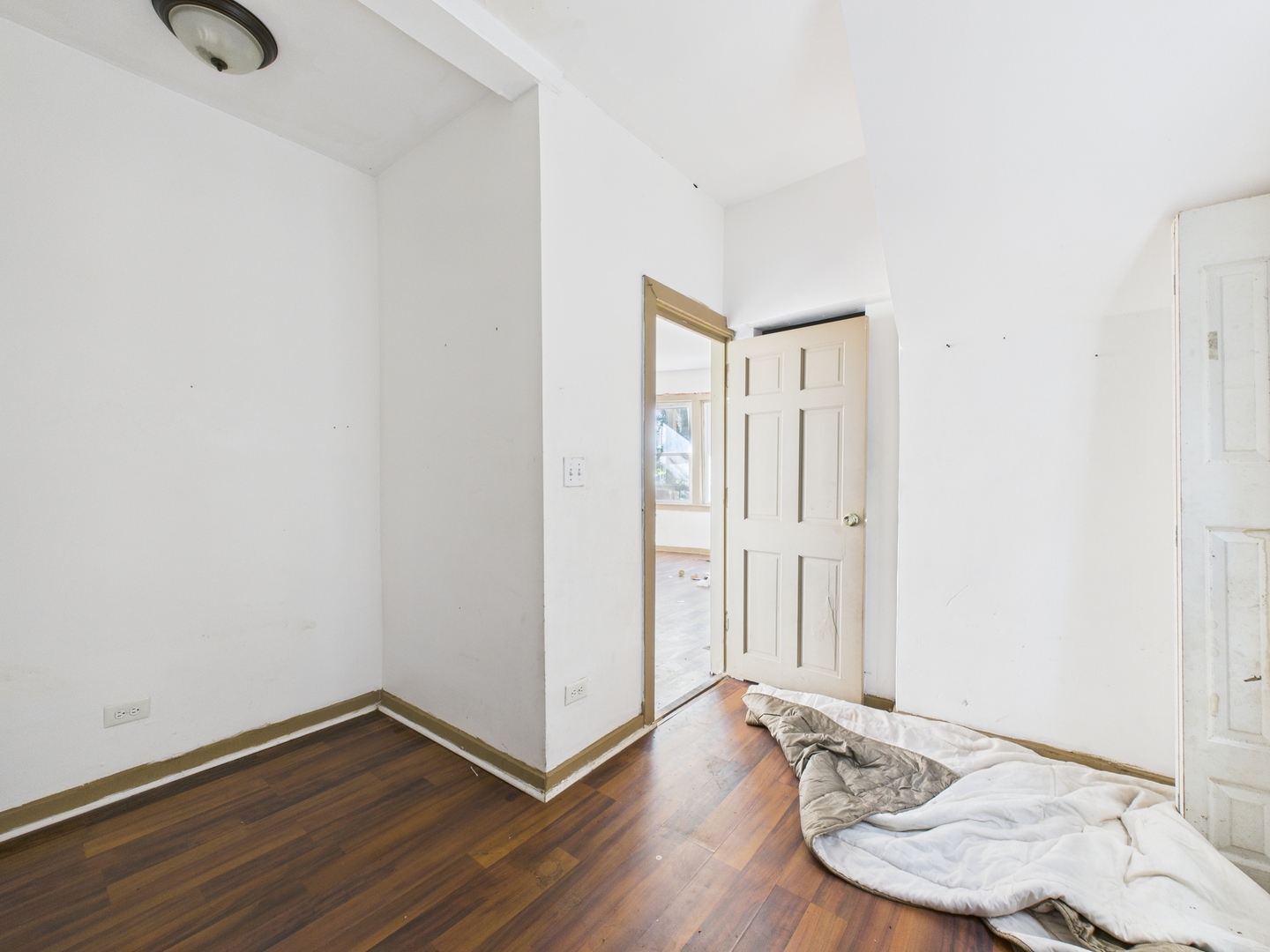 8709 South Escanaba Avenue Chicago, IL 60617 - Photo 5 of 31 a view of a room with wooden floor and bathroom