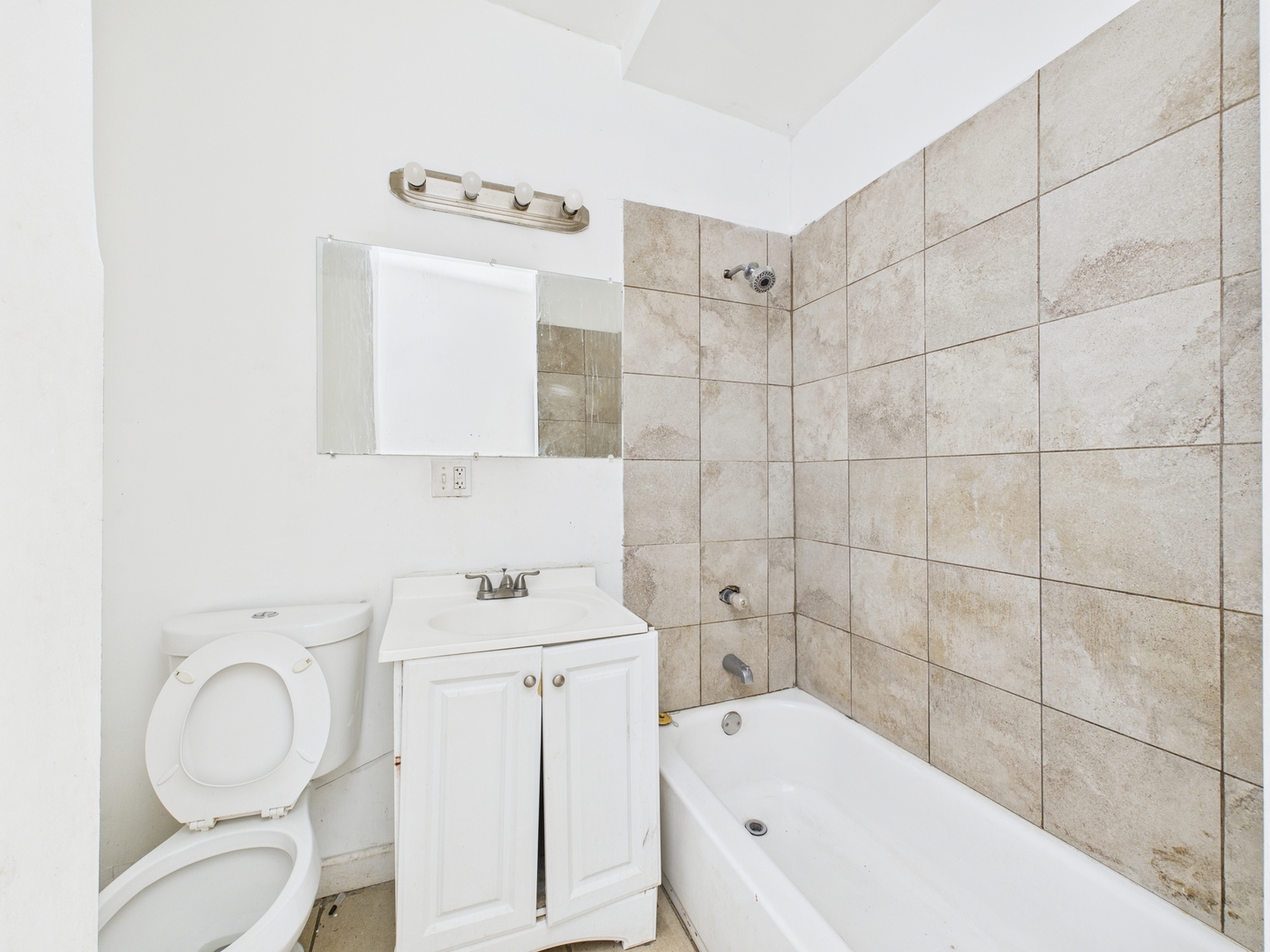 8709 South Escanaba Avenue Chicago, IL 60617 - Photo 9 of 31 a bathroom with a sink toilet and shower