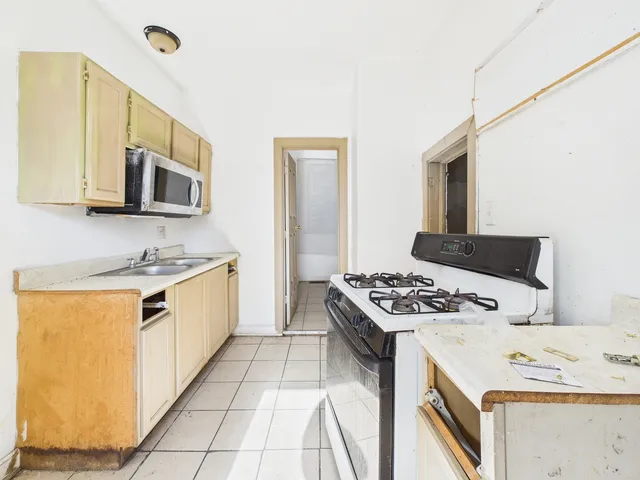 a kitchen with a stove and a sink