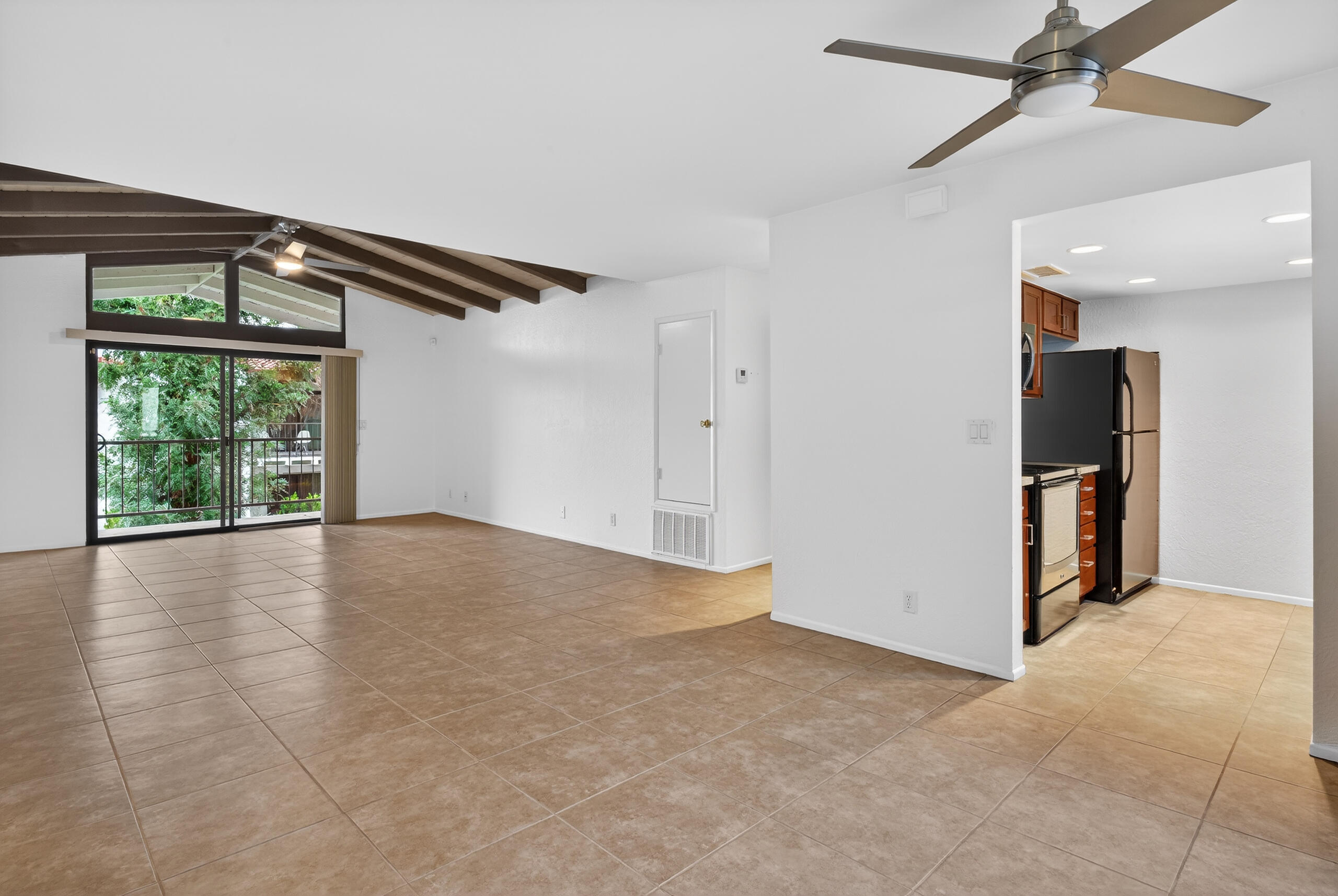 1050 Ramon Road, Unit 127 Palm Springs, CA 92264 - Photo 11 of 29 a view of empty room with wooden floor and fan