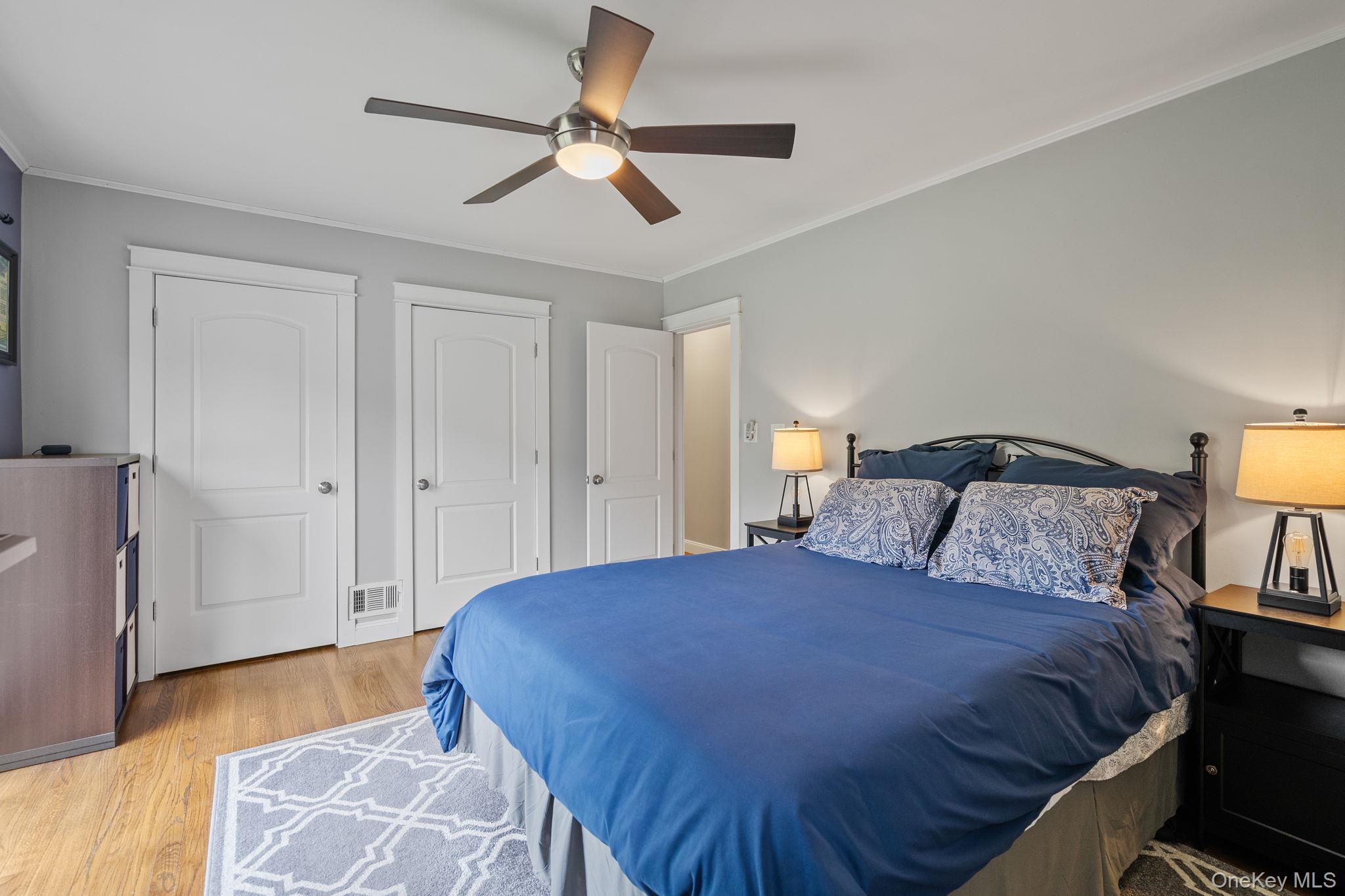 1327 County Rte 17 Montgomery, NY 12549 - Photo 17 of 37 a bedroom with a bed and a chandelier