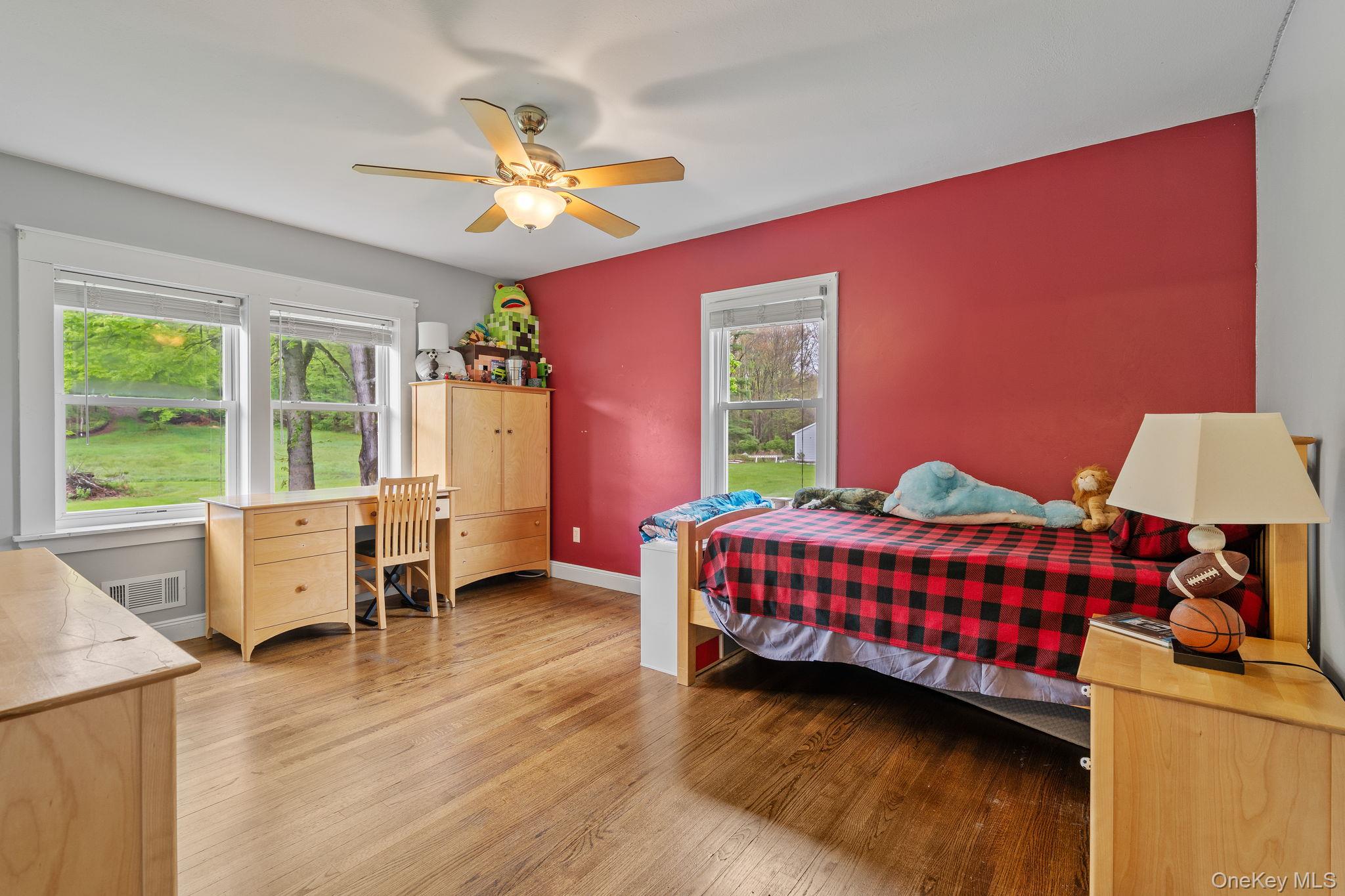 1327 County Rte 17 Montgomery, NY 12549 - Photo 19 of 37 a bedroom with a bed and a chandelier