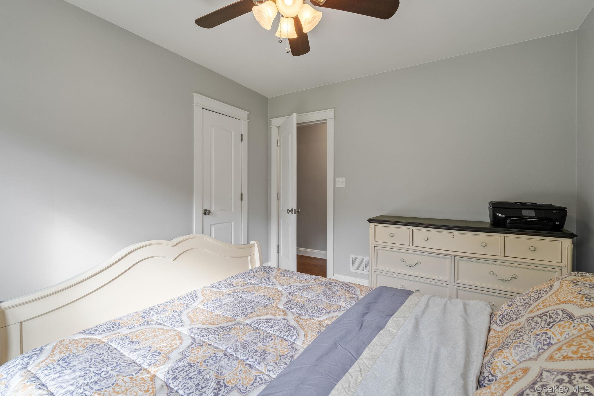 1327 County Rte 17 Montgomery, NY 12549 - Photo 22 of 37 a bedroom with a bed and a chandelier