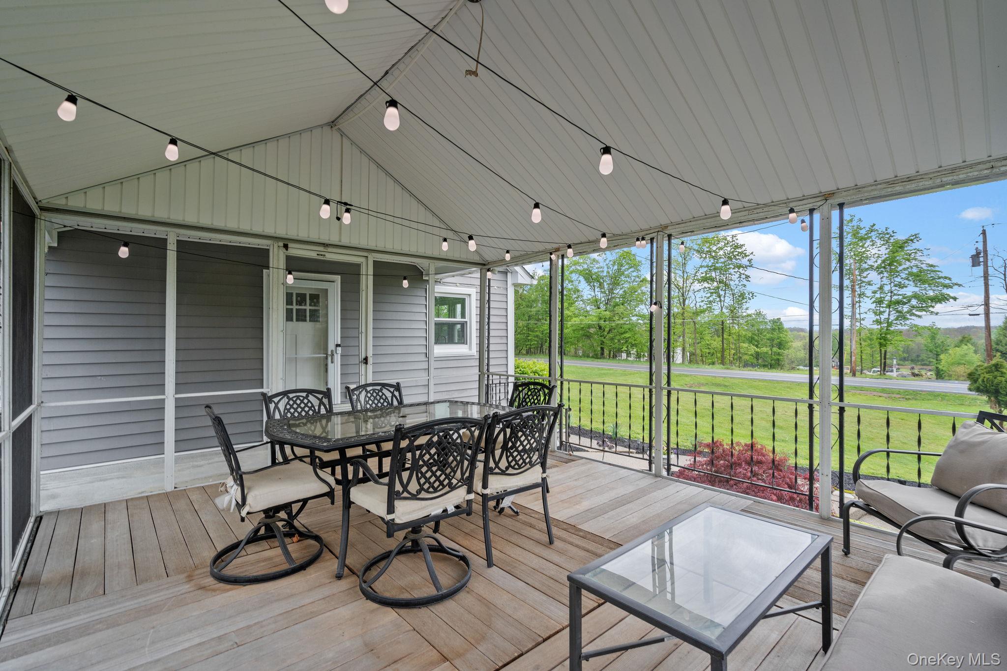 1327 County Rte 17 Montgomery, NY 12549 - Photo 26 of 37 a patio with yard glass top table and chairs