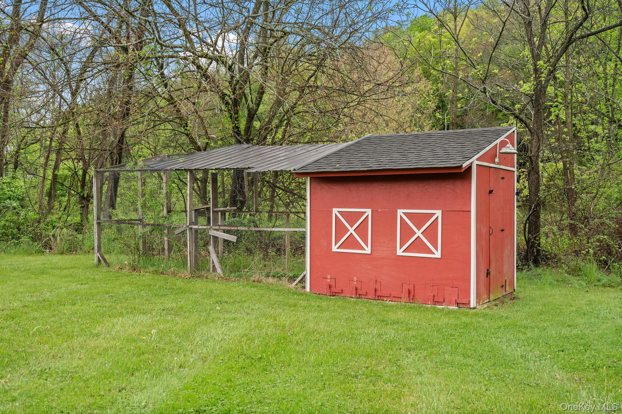 1327 County Rte 17 Montgomery, NY 12549 - Photo 27 of 37 a view of outdoor space with a garden and trees