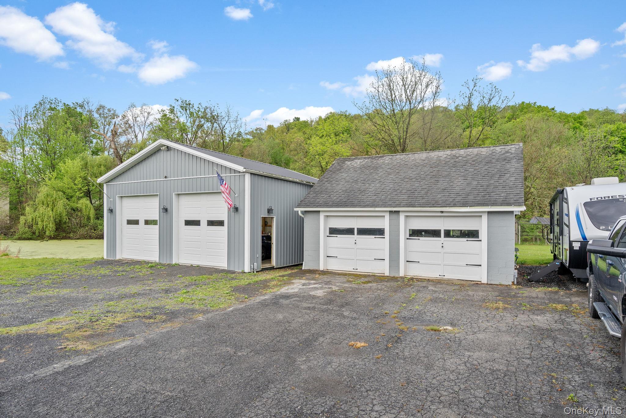 1327 County Rte 17 Montgomery, NY 12549 - Photo 28 of 37 a front view of a house with a yard and garage