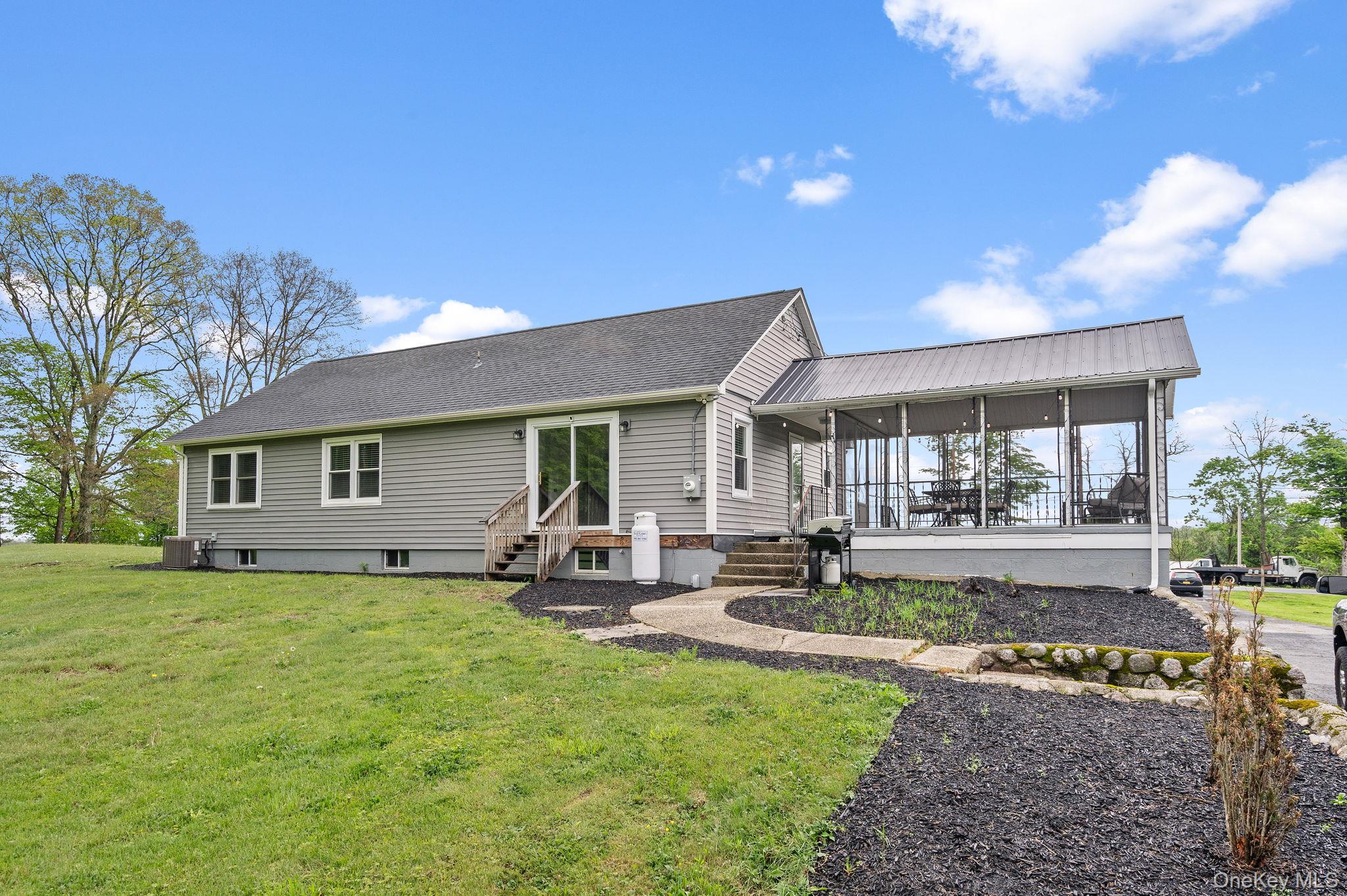 1327 County Rte 17 Montgomery, NY 12549 - Photo 32 of 37 a view of a house with a yard porch and sitting area