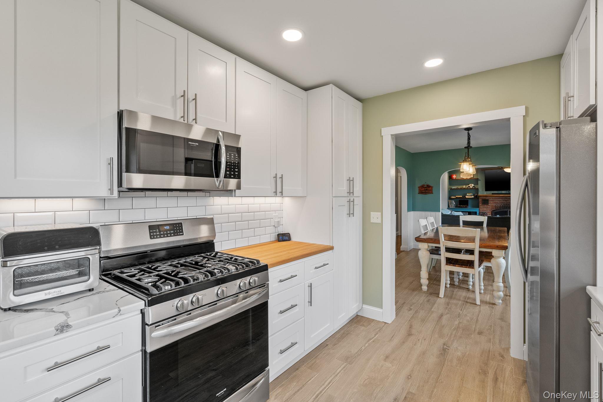 1327 County Rte 17 Montgomery, NY 12549 - Photo 5 of 37 a kitchen with stainless steel appliances a stove a sink and a microwave