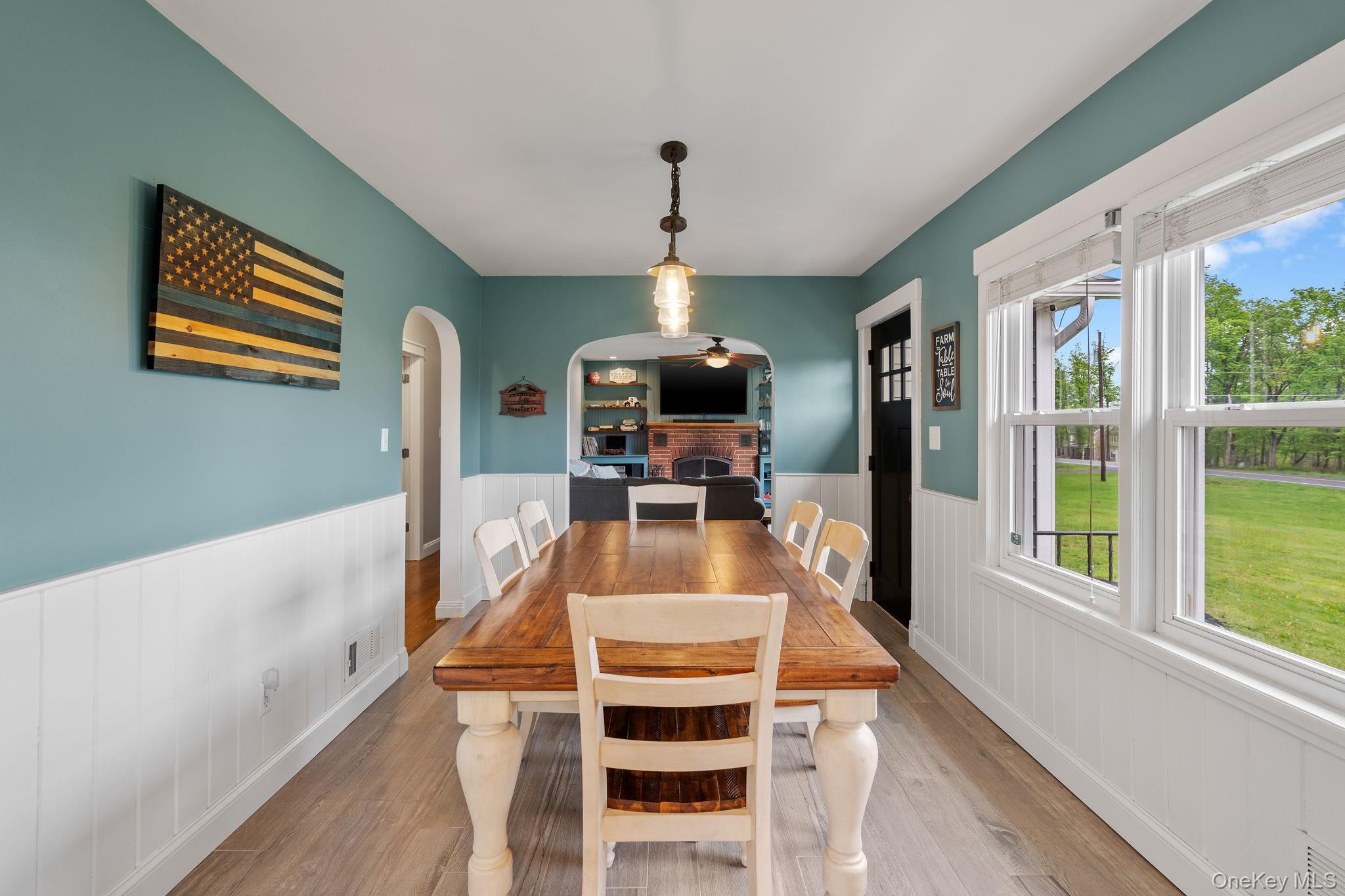 1327 County Rte 17 Montgomery, NY 12549 - Photo 7 of 37 a view of a dining room with furniture a chandelier and wooden floor