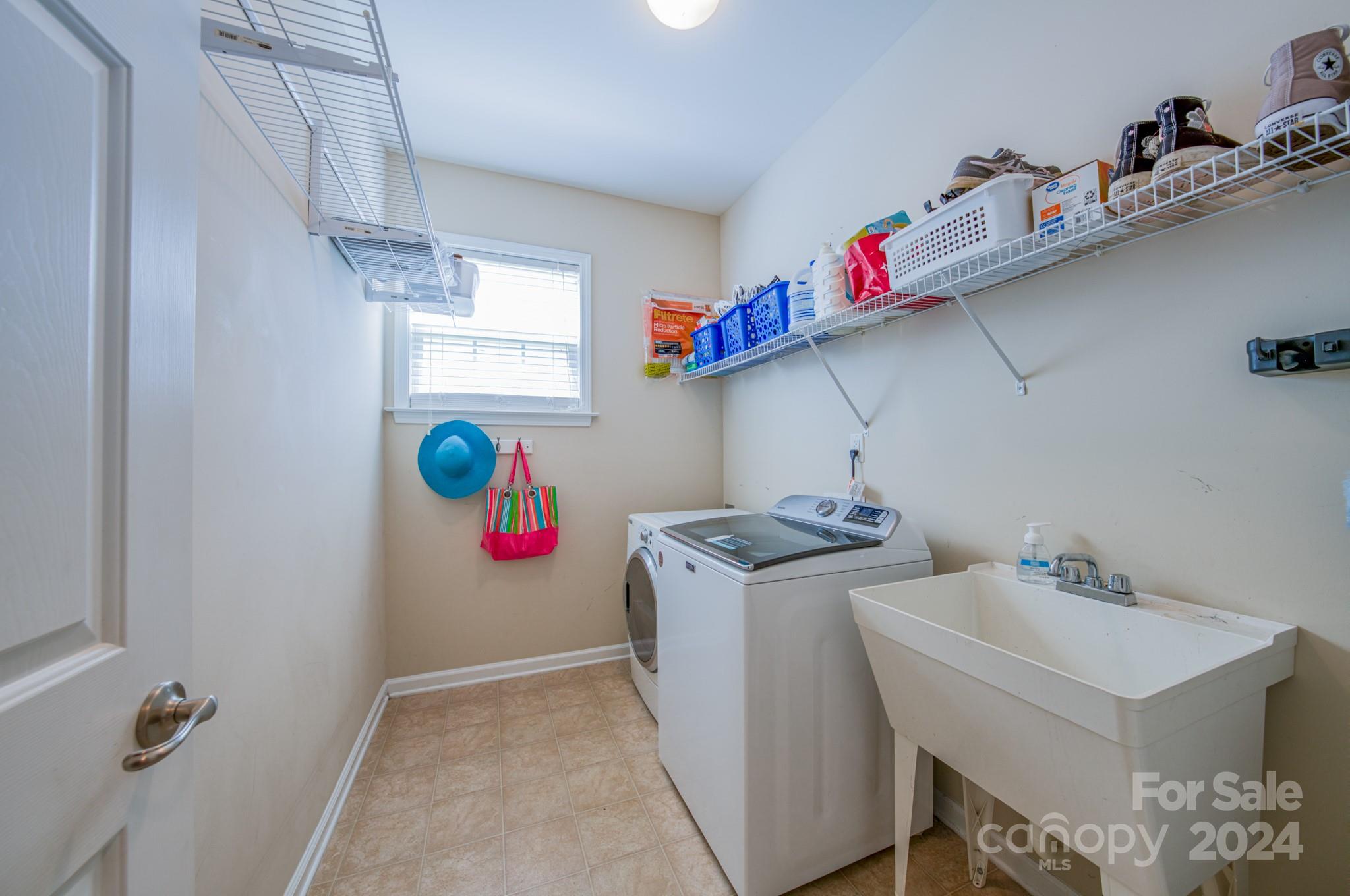 234 Roanoke Road Fletcher, NC 28732 - Photo 12 of 24 a utility room with dryer and washer