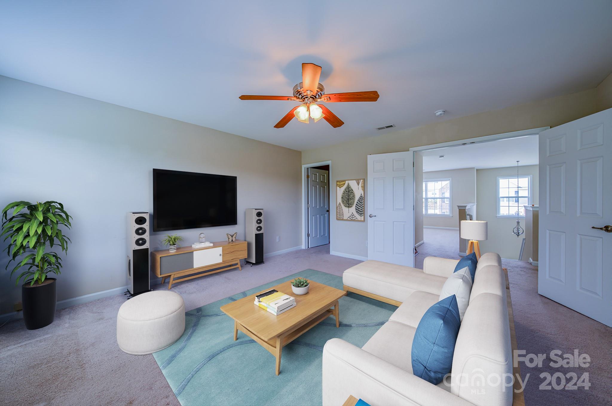 234 Roanoke Road Fletcher, NC 28732 - Photo 14 of 24 a living room with furniture and a flat screen tv
