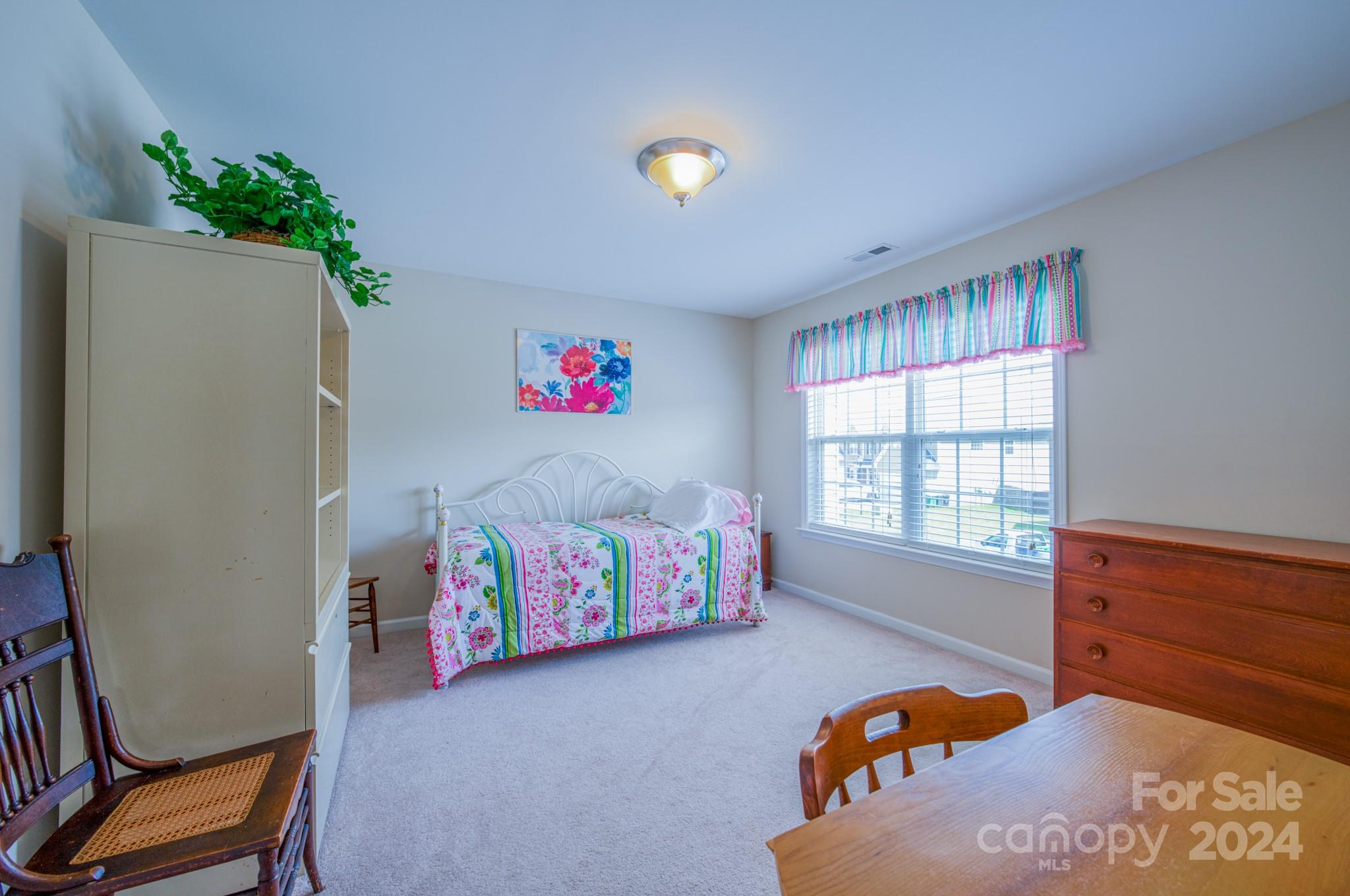 234 Roanoke Road Fletcher, NC 28732 - Photo 15 of 24 a bedroom with a bed and a window