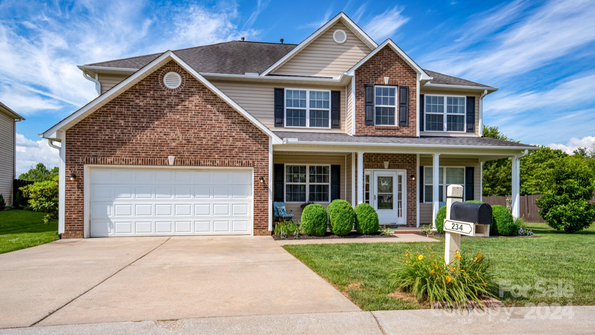 234 Roanoke Road Fletcher, NC 28732 - Photo 2 of 24 a front view of a house with a yard