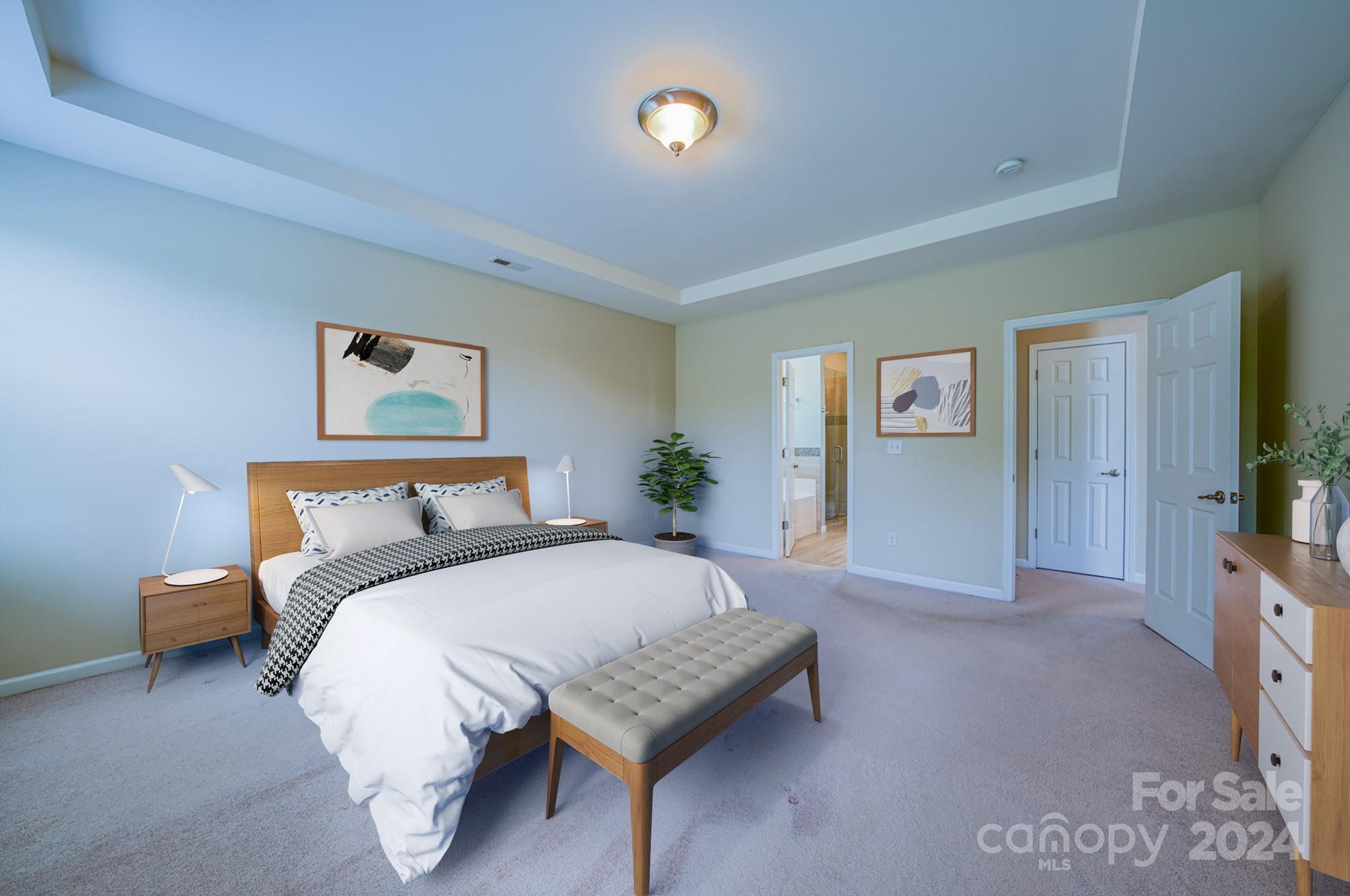 234 Roanoke Road Fletcher, NC 28732 - Photo 7 of 24 a bedroom with a bed and a flat screen tv