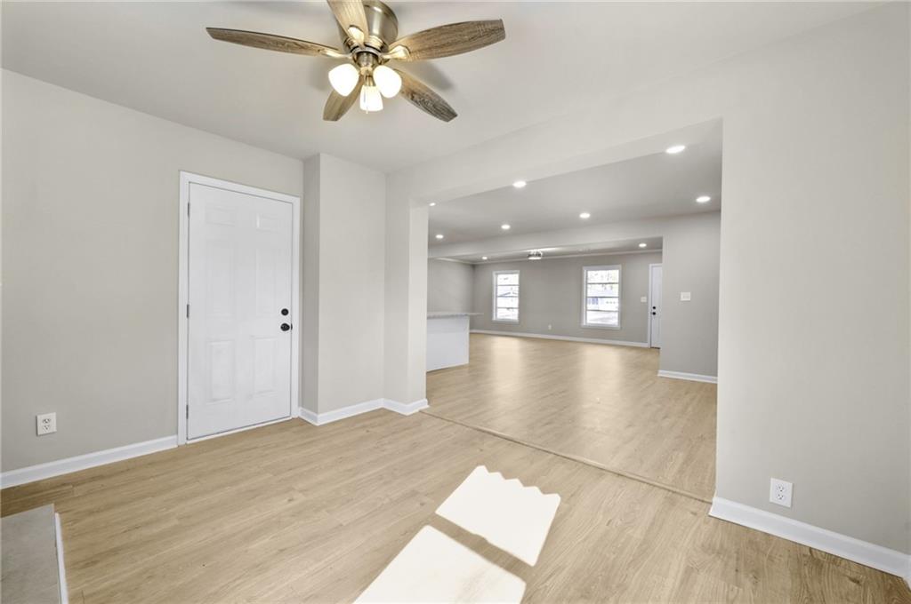 1963 Shepherd Circle Southwest Atlanta, GA 30311 - Photo 16 of 40 a view of empty room with wooden floor and fan