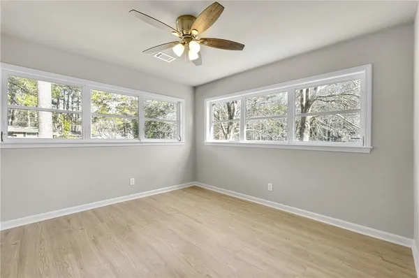 a view of an empty room with a window