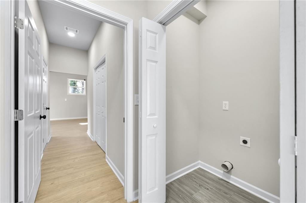 1963 Shepherd Circle Southwest Atlanta, GA 30311 - Photo 29 of 40 a view of a hallway with wooden floor
