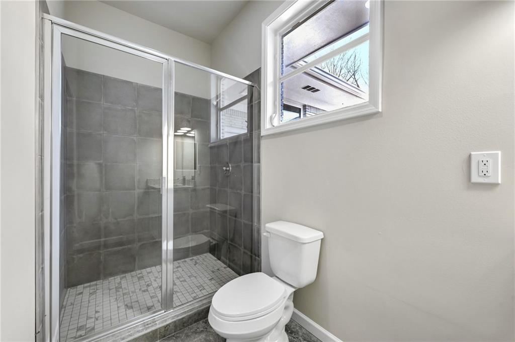 1963 Shepherd Circle Southwest Atlanta, GA 30311 - Photo 30 of 40 a white toilet sitting next to a bathroom sink