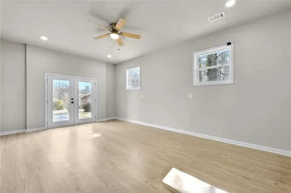 a view of an empty room with a window