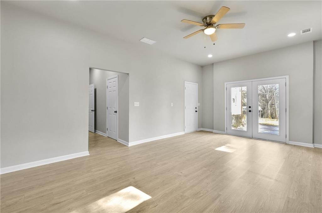 1963 Shepherd Circle Southwest Atlanta, GA 30311 - Photo 33 of 40 wooden floor in an empty room with a window