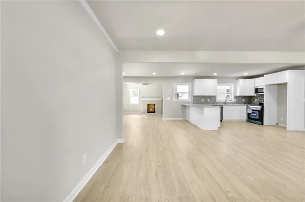 a view of a kitchen with wooden floor