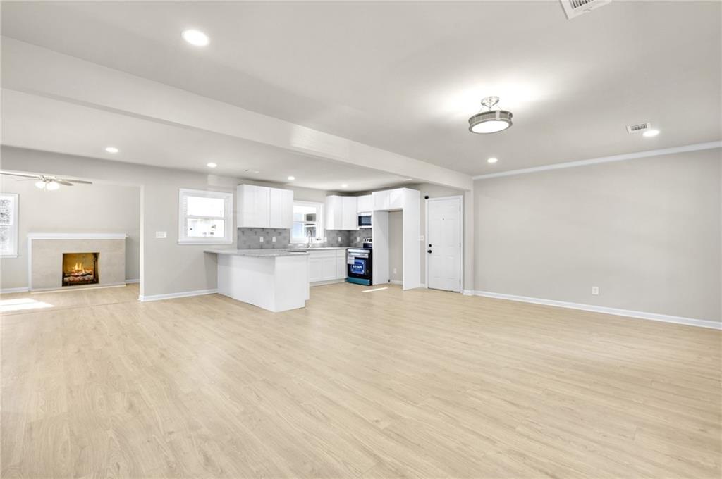 1963 Shepherd Circle Southwest Atlanta, GA 30311 - Photo 5 of 40 a view of a kitchen with a sink and a refrigerator