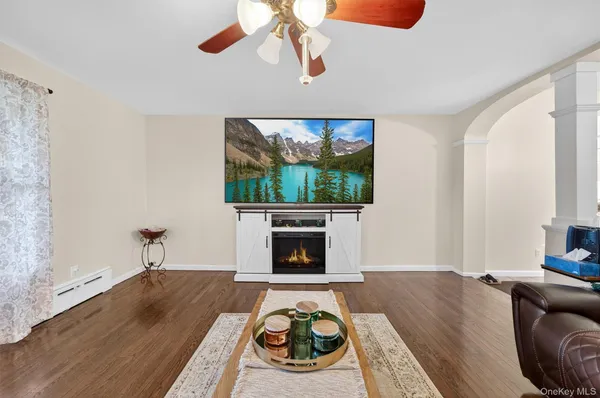 a living room with furniture and a fireplace