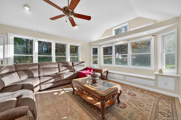 a living room with furniture and a window