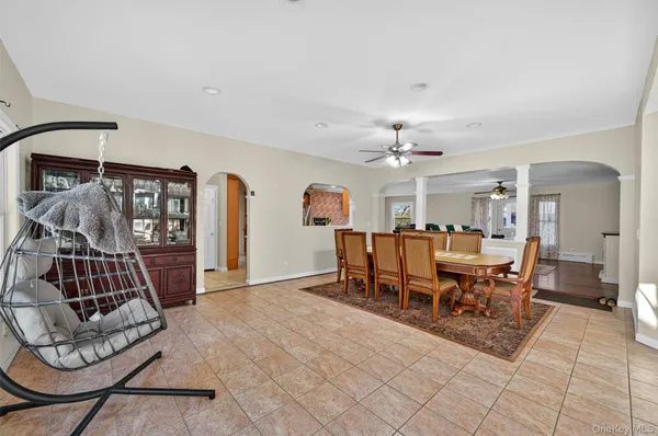 a dining room with furniture and window