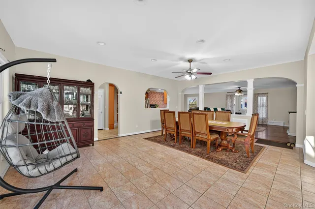 a dining room with furniture and window